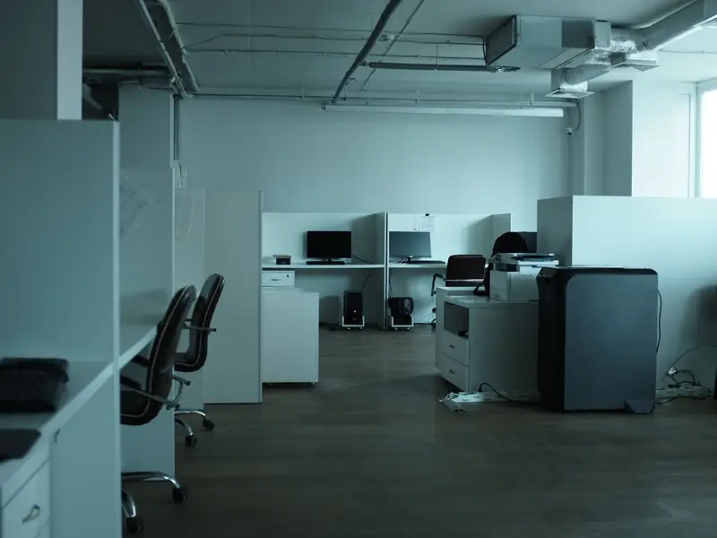 An open-plan office with ceiling lights