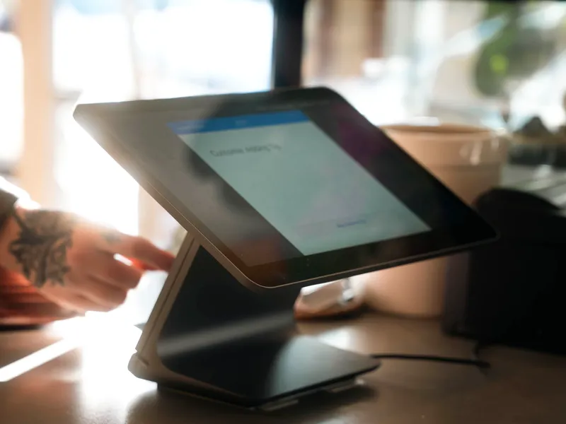 A tablet EPOS till on a sunny café counter